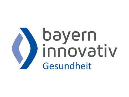 Logo von Bayern Innovativ Gesundheit mit modernen, geschwungenen Elementen in Blau und Grün.
